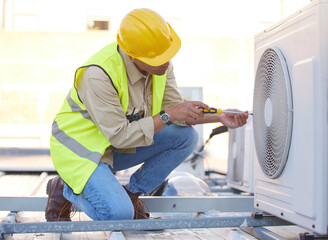 Air conditioning, technician or engineer on roof for maintenance, building or construction of fan hvac repair. Air conditioner, handyman or worker with tools working on a city development project job