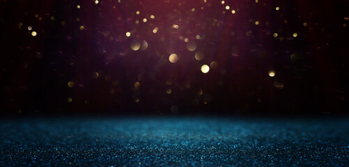 background of abstract glitter lights. gold, blue and black. de focused