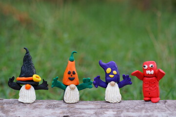 Figures of dwarfs decorated for Halloween. Funny toys.