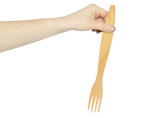 wooden fork in hand isolated from background, concept of hand over or throw away wooden fork