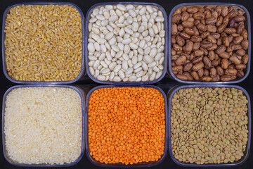 Various legumes and grains. Beans, kidney beans, green lentils, red lentils, rice and wheat.