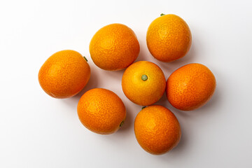 Kumquats on a white background