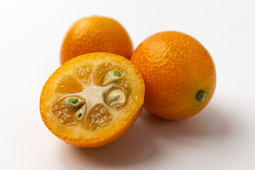 Kumquats on a white background