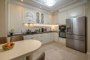 Classic beige kitchen with counter space and a variety of appliances