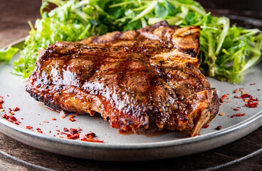 Porterhouse beef steak cooked on a grill on plate