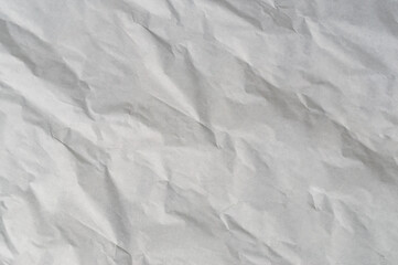 Wrinkled or crumpled white stencil paper or tissue after use in toilet or restroom with large copy space used for background texture in art work