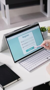 Businesswoman's Hand Filing Online Registration Form