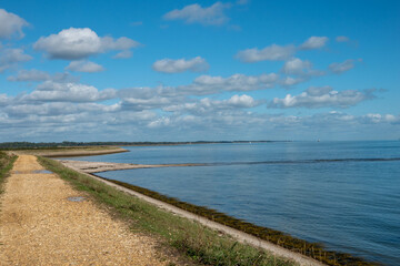 Fototapeta premium Footpath along The Solent Way trail at Lymington Hampshire England on a sunny summer day
