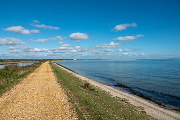 Footpath along The Solent Way trail at Lymington Hampshire England on a sunny summer day