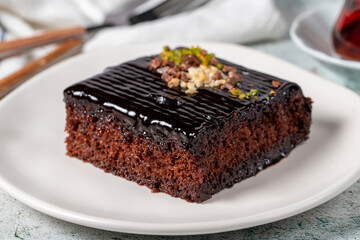Chocolate slice cake on gray background. Chocolate moist cake. Bakery desserts. close up