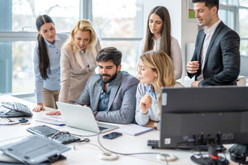 Large group of business people working together on new business project in office.