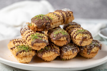 Chocolate, pistachio and coconut cookies on gray background. Bakery cookies assortment. Close up