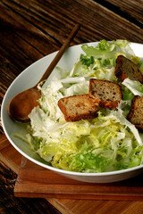 Fresh endive salad with toasted bread rolls