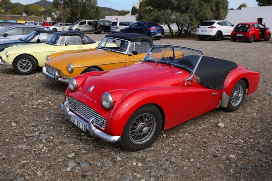 CADAQUES, SPAIN - OCTOBER 5, 2021: Triumph TR2 red roadster sports car parked in Spain.