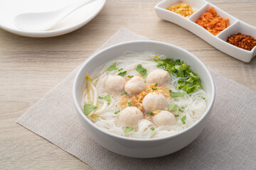 Rice vermicelli Noodle soup with pork balls in white bowl - obrazy, fototapety, plakaty