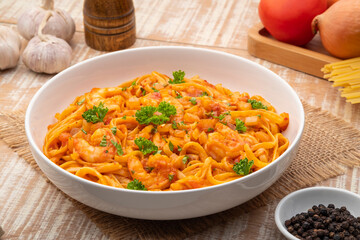 Spicy Shrimp Spaghetti with Tomato Sauce in white plate,linguine pasta