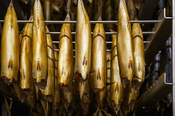 Closeup view of smoked mackerel in factory oven.