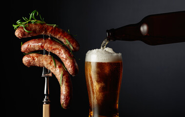 Beer and grilled sausages with rosemary.