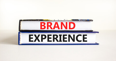 Brand experience symbol. Concept words Brand experience on books. Beautiful white table white background. Business branding and brand experience concept. Copy space.
