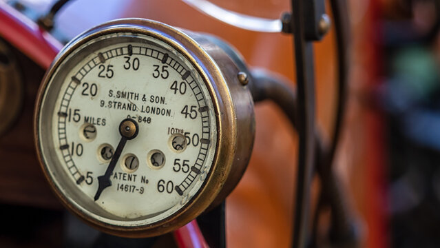 SUSSEX, UK - SEPTEMBER 14, 2019:  Old brass Speedometer made by S Smith and Son on a vintage car