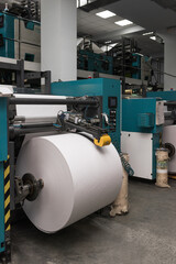 Printing house warehouse interior with printing machine