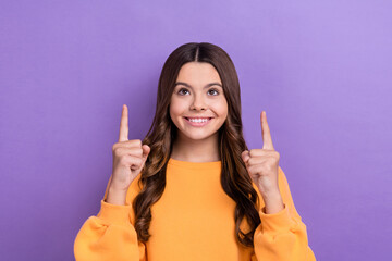 Photo of positive cute lady wear winter trendy orange sweater two arm direct empty space discounts isolated on purple color background