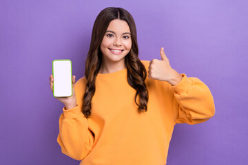 Photo of positive cute lady blogger presenting ui novelty advise app scan qr code thumb up isolated...