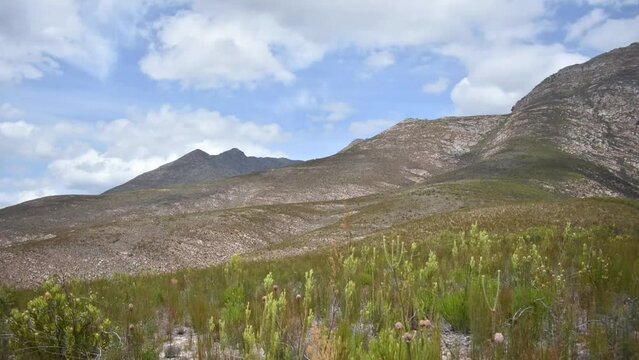 a hyperlaps of clouds moving over the cloetesberg mountain range in the little karoo semi desert area of the western cape province of south africa 