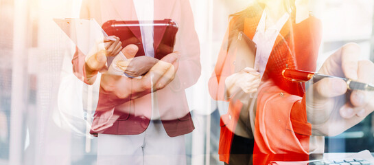 Businessman and team analyzing financial statement Finance task. with smart phone and laptop and...