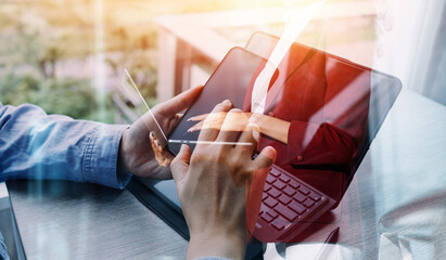 Businessman and team analyzing financial statement Finance task. with smart phone and laptop and...