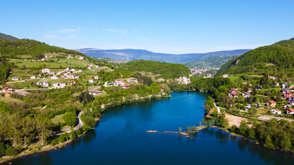 Fototapeta na wymiar Plivsko jezero, Jajce, Bosnia and Herzegovina. Aerial drone view of lake, villages and forest in early spring. 
