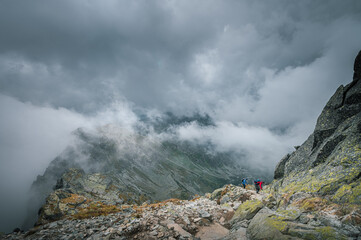 Breathtaking views over the valley of impressive Tatra mountains in misty weather. National park in Zakopane, Poland.