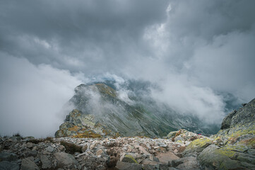 Breathtaking views over the valley of impressive Tatra mountains in misty weather. National park in Zakopane, Poland.