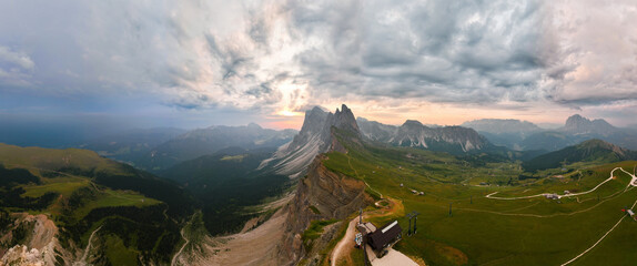 Stunning panoramic view of the Seceda ridge during a cloudy day. The Seceda with its 2.500 meters is the highest vantage point in Val Gardena, Dolomites, Italy.. - obrazy, fototapety, plakaty