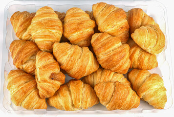 close up on butter cocktail croissants in the container