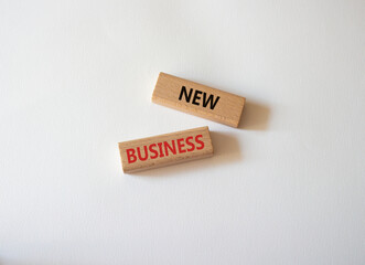 New business symbol. Concept words New business on wooden blocks. Beautiful white background. Business and New business concept. Copy space.