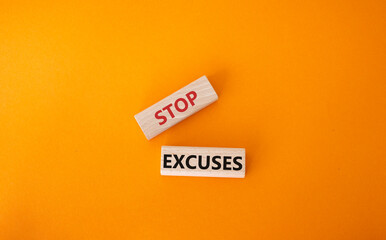 Stop excuses symbol. Concept words Stop excuses on wooden blocks. Beautiful orange background....