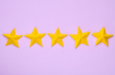 Five origami stars on a magenta background. Service rating