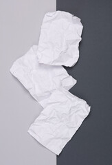 White crumpled piece of papers on paper background