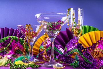 Mardi gras cocktails set. Colorful purple, yellow, green martini champagne wine cocktail glasses...