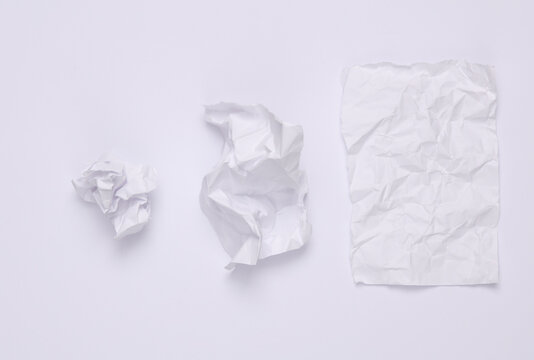 Step by step process of crumpling paper into a ball on a white background