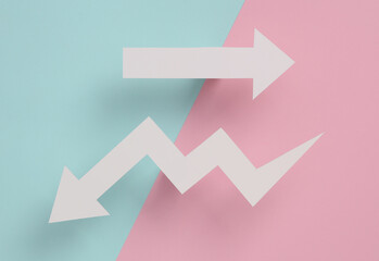 Pointing arrow and drop arrow cut out of paper on a gray background