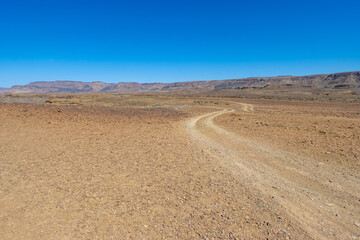 car track in the half desert of the fish river canyon