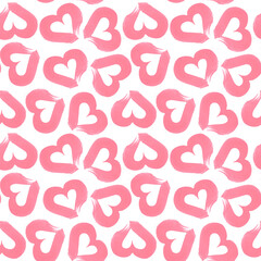 Seamless watercolor pattern of pink hearts with white hearts inside isolated on a white background. Texture of brush strokes with pink paint