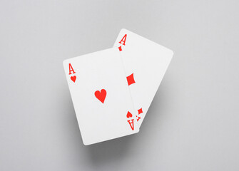 Ace of diamonds and hearts on a gray background. Playing cards