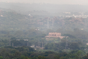 An ancient Qutb Shahi monument in the green surrounds of the outskirts of the city of Hyderabad.