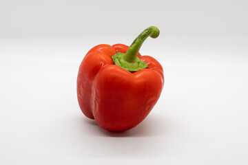 Whole Red Bell Pepper (Capsicum) on a white background