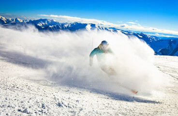 Male skier extreme skiing downhill pass side super fast in snowy conditions to gondola with...