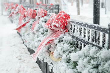 red and white snow covered fence
