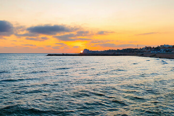 Fototapeta na wymiar Sunset on the Spanish beach of Sitges, Catalonia, Spain.